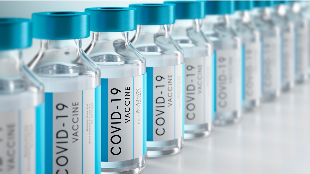 photo showing closeup of covid vaccine bottles